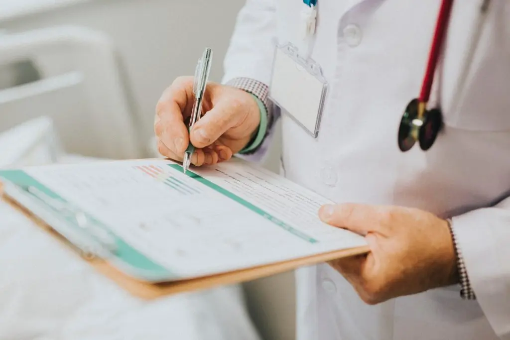Medical Professional with clipboard and pen