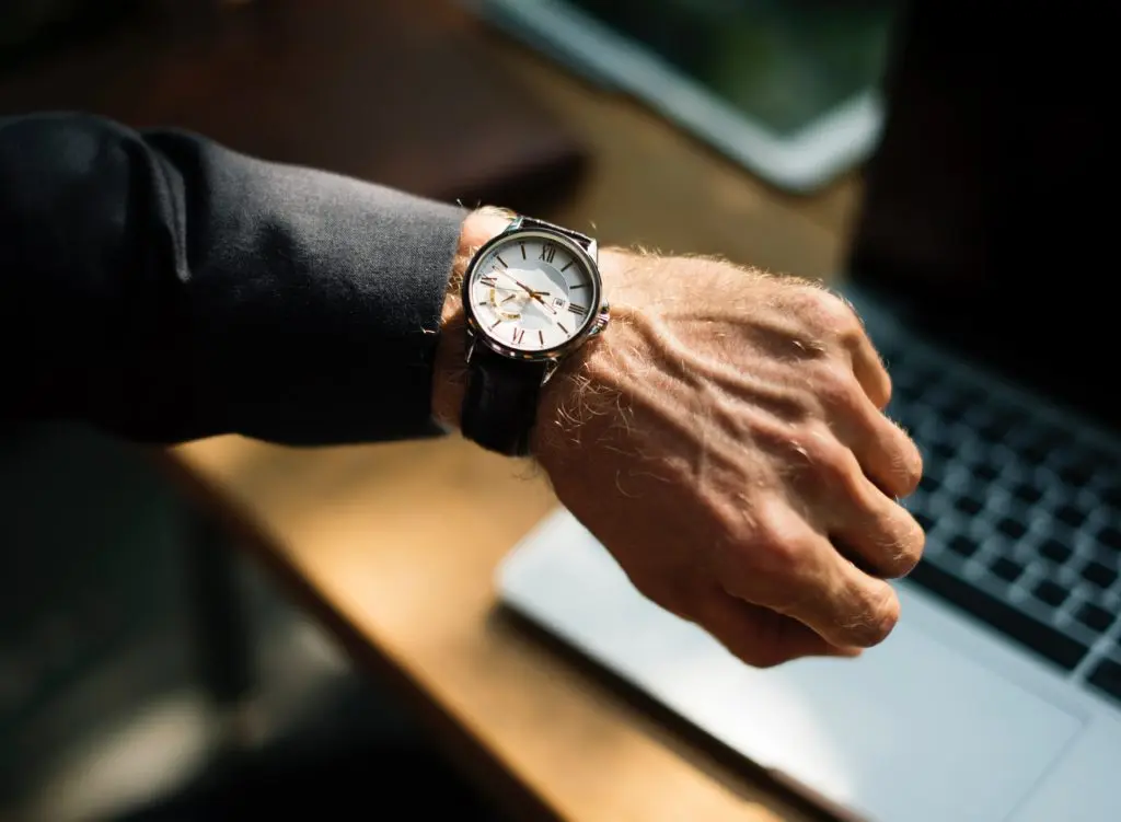 Man's wrist with watch face