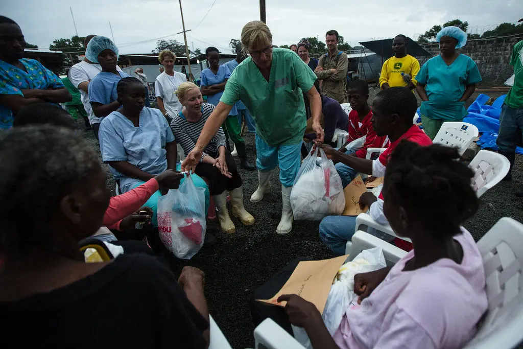 A doctor with 'Doctors Without Borders' handing out supplies